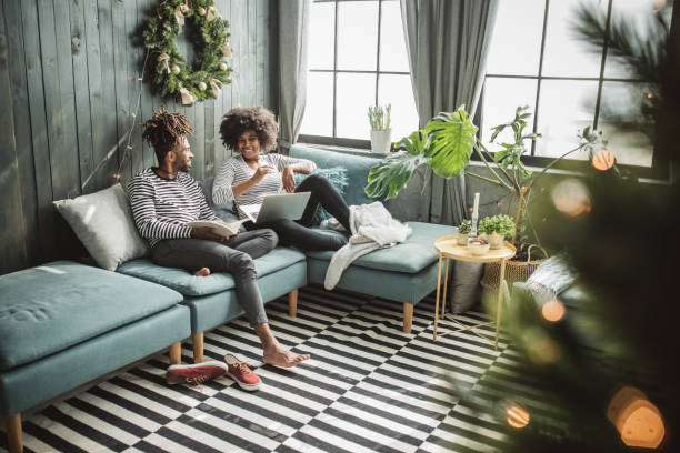 Young couple at home enjoy in weekend, they are using laptops while resting.